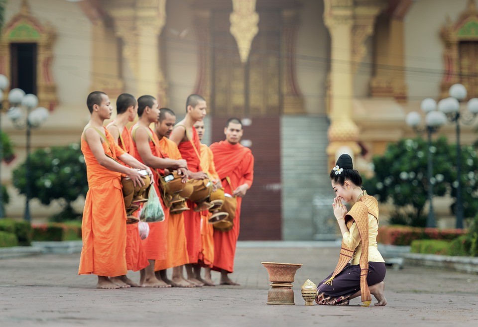 offering food to buddhist monks in bangkok